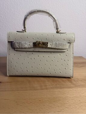 H Mini Kelly Sellier 20 embossed ostrich leather GHW craie beton cream